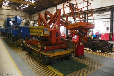 image showing a large yellow on-track machine
