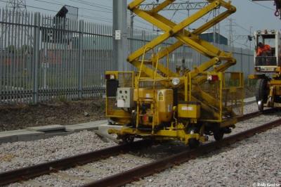 image showing a large yellow on-track machine