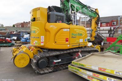 image showing a large yellow on-track machine
