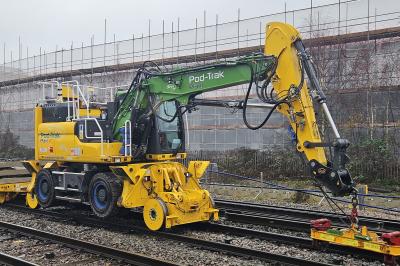 image showing a large yellow on-track machine