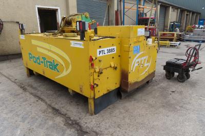 image showing a large yellow on-track machine