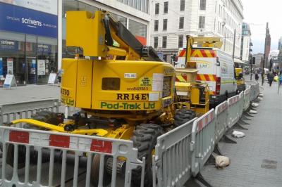 image showing a large yellow on-track machine
