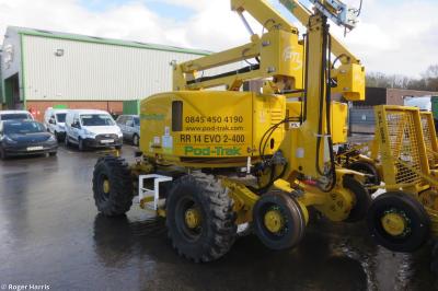 image showing a large yellow on-track machine