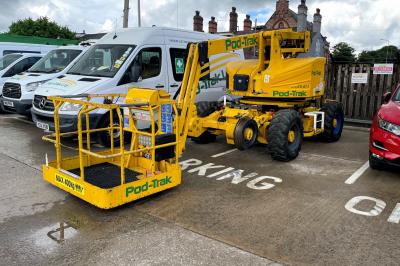 image showing a large yellow on-track machine