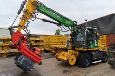 image showing a large yellow on-track machine