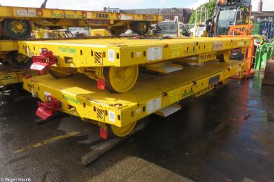 image showing a large yellow on-track machine