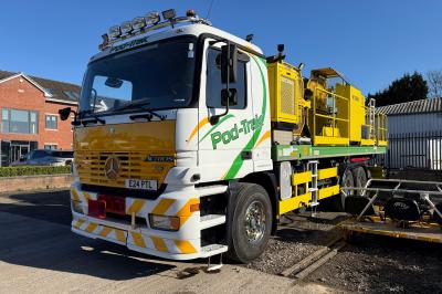 image showing a large yellow on-track machine