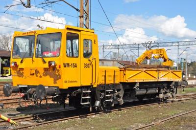 image showing a large yellow on-track machine