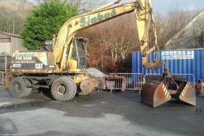 image showing a large yellow on-track machine