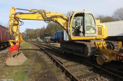image showing a large yellow on-track machine
