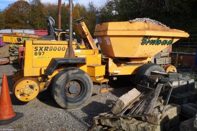 image showing a large yellow on-track machine