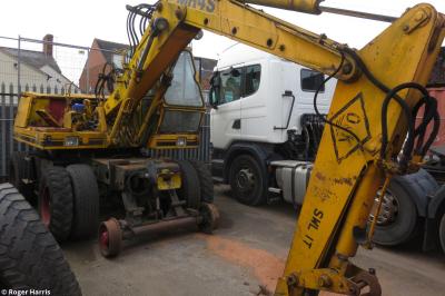 image showing a large yellow on-track machine