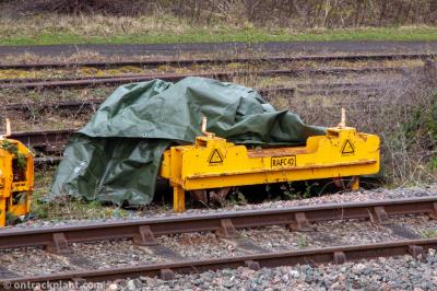 image showing a large yellow on-track machine