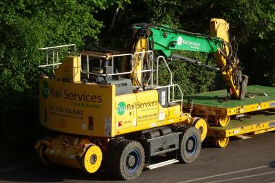 image showing a large yellow on-track machine