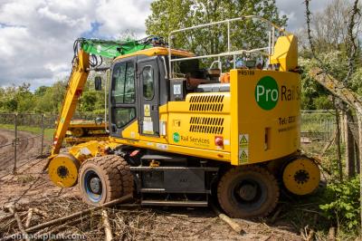 image showing a large yellow on-track machine