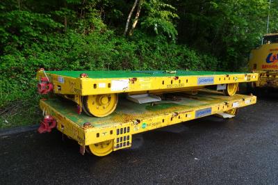 image showing a large yellow on-track machine