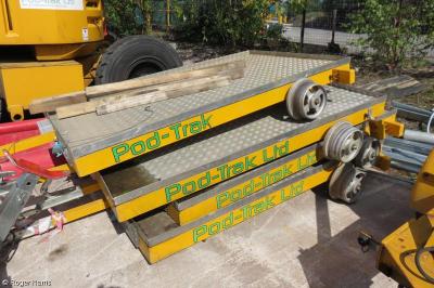 image showing a large yellow on-track machine