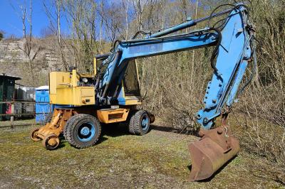 image showing a large yellow on-track machine
