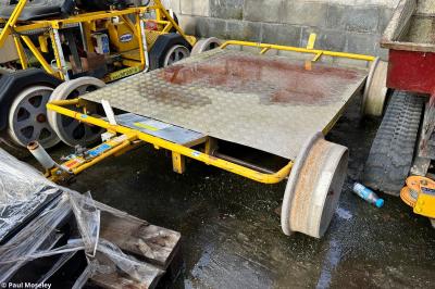 image showing a large yellow on-track machine