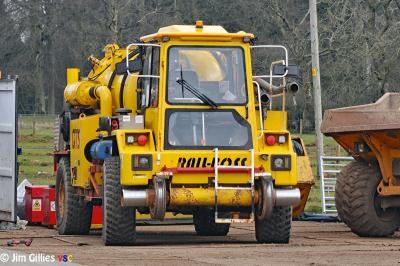 image showing a large yellow on-track machine