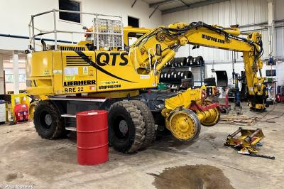 image showing a large yellow on-track machine
