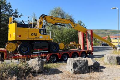 image showing a large yellow on-track machine