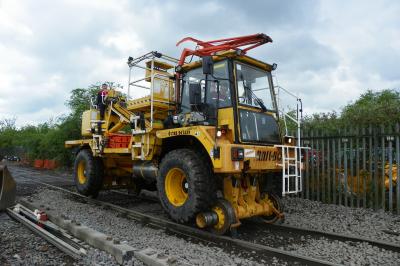 image showing a large yellow on-track machine