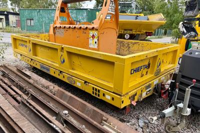image showing a large yellow on-track machine