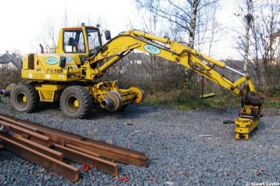 image showing a large yellow on-track machine