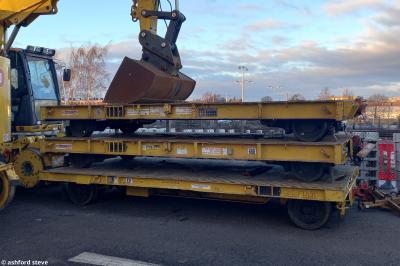 image showing a large yellow on-track machine