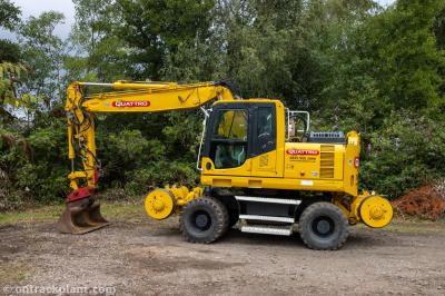 image showing a large yellow on-track machine
