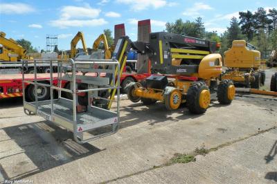 image showing a large yellow on-track machine