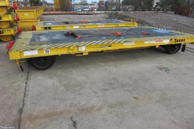 image showing a large yellow on-track machine