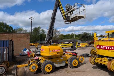 image showing a large yellow on-track machine