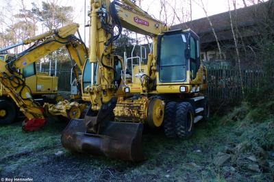 image showing a large yellow on-track machine