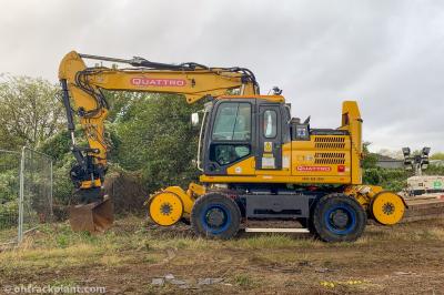 image showing a large yellow on-track machine