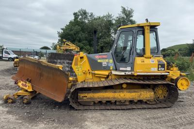 image showing a large yellow on-track machine