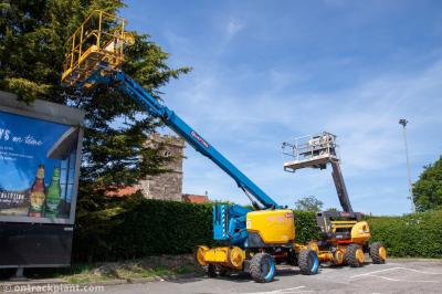 image showing a large yellow on-track machine