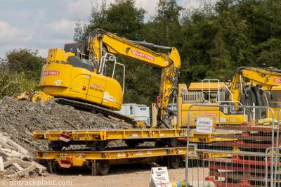 image showing a large yellow on-track machine