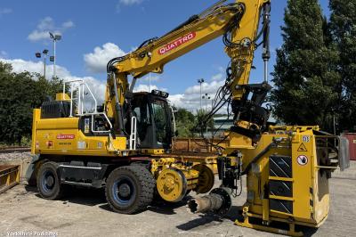 image showing a large yellow on-track machine