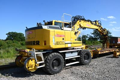 image showing a large yellow on-track machine