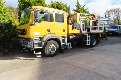 image showing a large yellow on-track machine
