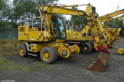 image showing a large yellow on-track machine