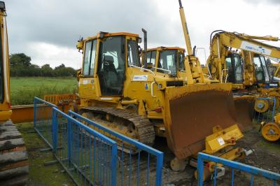 image showing a large yellow on-track machine