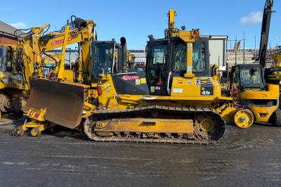 image showing a large yellow on-track machine