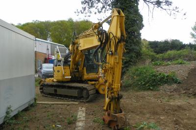 image showing a large yellow on-track machine