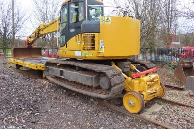 image showing a large yellow on-track machine
