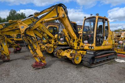 image showing a large yellow on-track machine