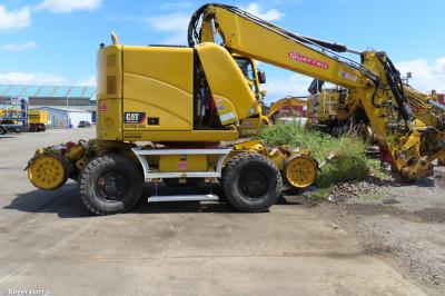 image showing a large yellow on-track machine
