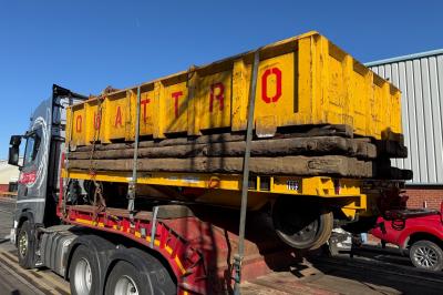 image showing a large yellow on-track machine